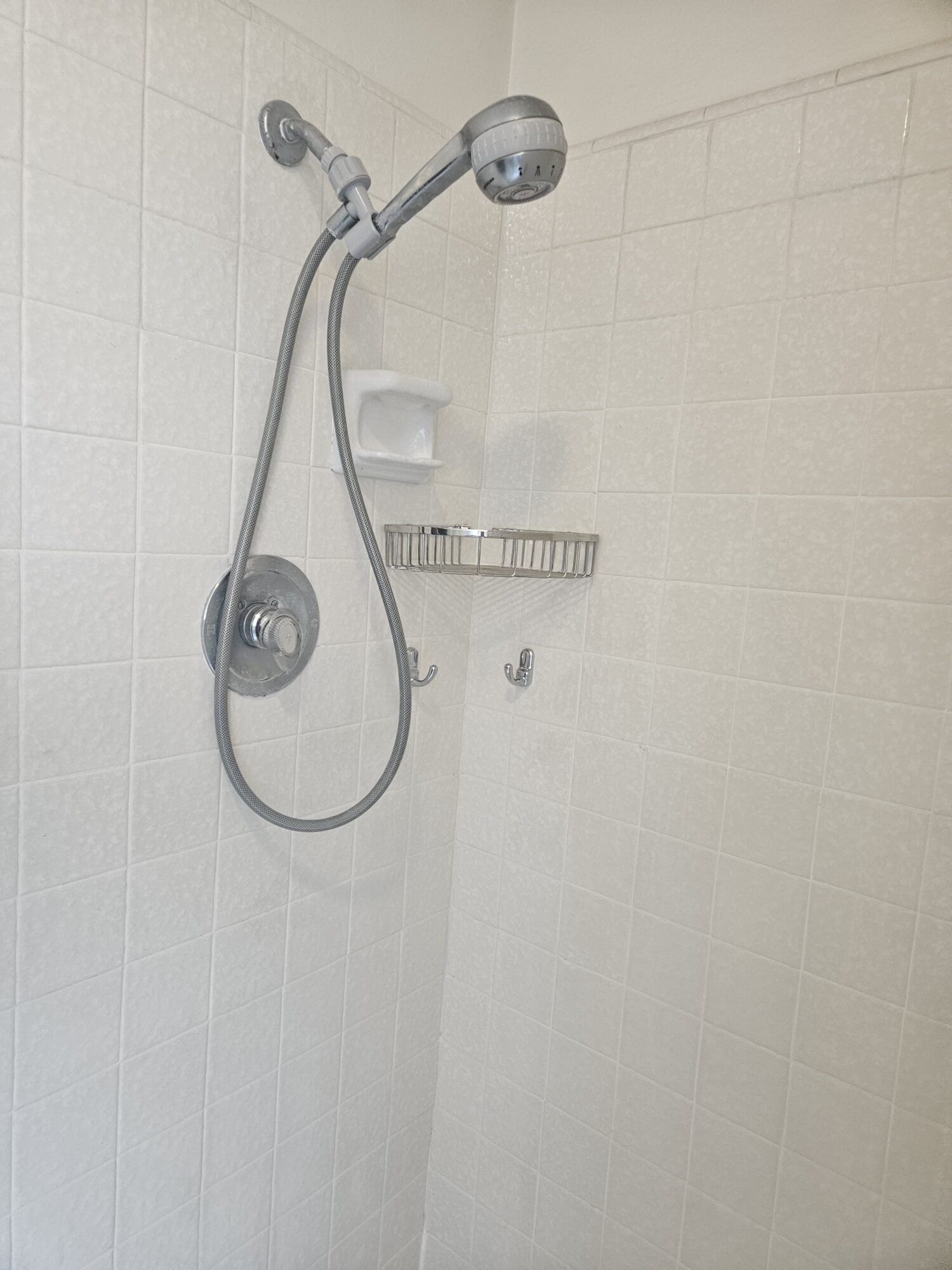 Volunteer Handyman Week 1 Final product! Securely mounted basket and hooks.